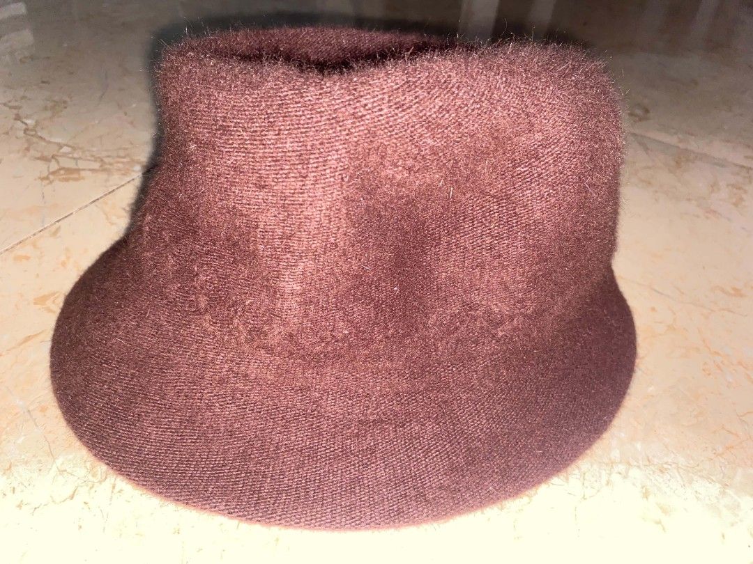 bucket hat (Category: Hats & Beanies) located in Cebu City. Submitted by arni1 (Listing ID 1464724807, Image 3). Description: - Style: Fuzzy knit wide brim bucket hat - Color: Deep brown and maroon - Size: 57.5 cm - Material: Soft, warm textured - Condition: Like new / Great everyday cold-weather accessory - 100 each.