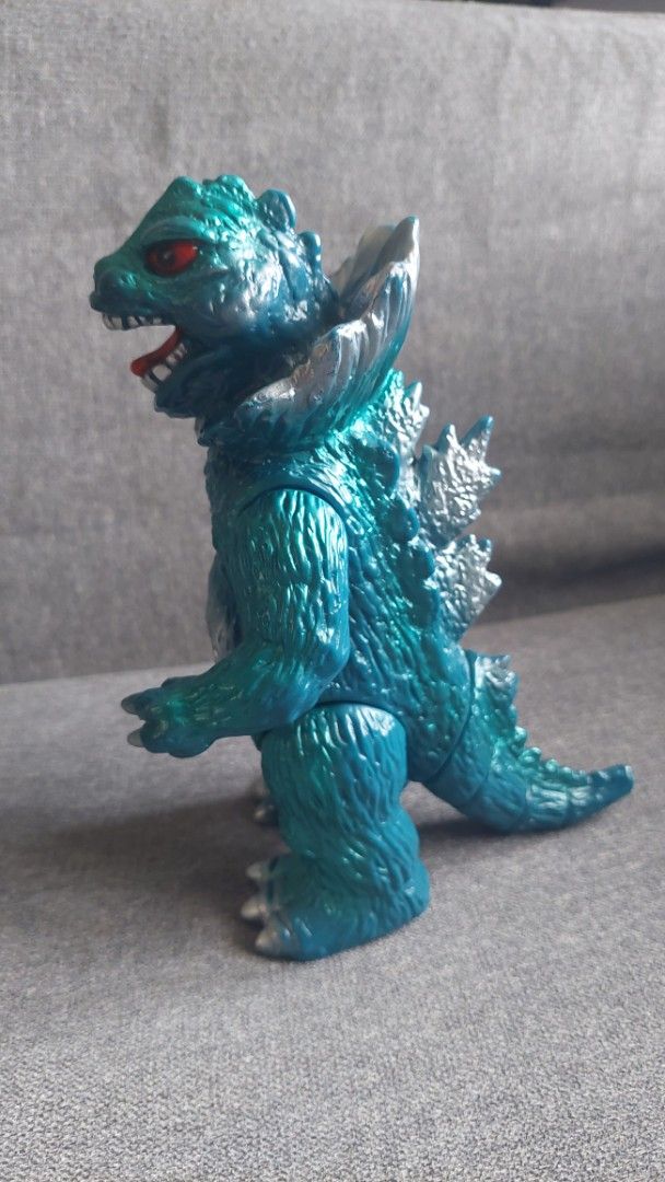 Bullmark Vintage sofubi Jiras (Category: Figurines & Statues) located in Valenzuela. Submitted by jaguar0706 (Listing ID 1464719886, Image 3). Description: - Authentic Bandai Jiras soft vinyl monster figure from Ultraman - Striking metallic blue body with detailed silver dorsal fins, chest, and claws - Features vibrant red eyes and mouth interior with official foot stamps - Articulated arms and tail joints for easy posing - Stands at approximatel