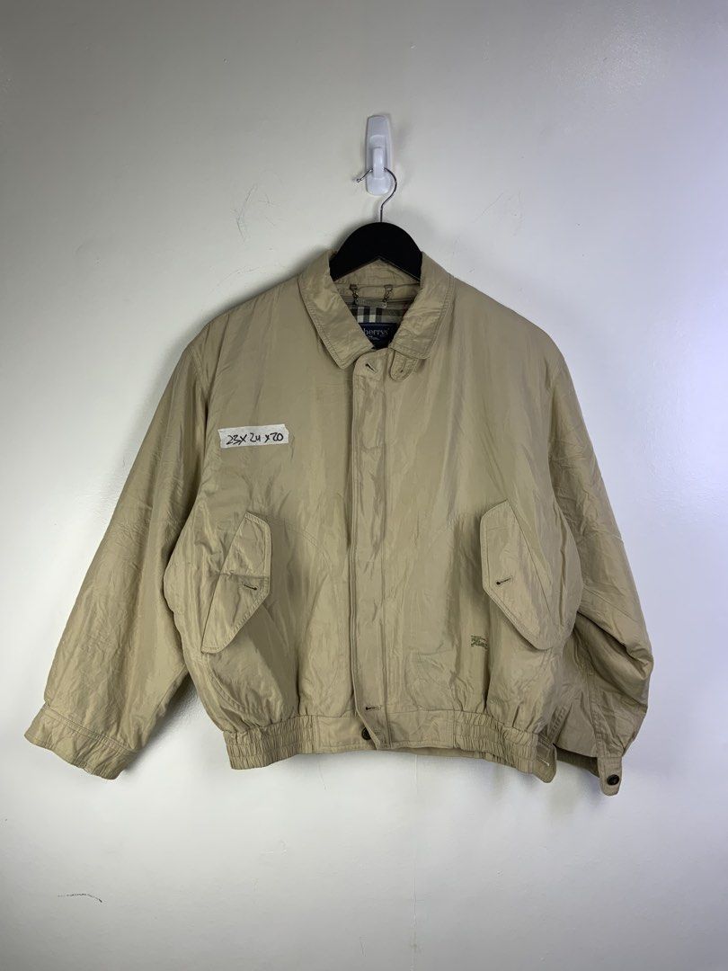 Burberry Beige Nova Check Lined Bomber Jacket Medium (Category: Coats, Jackets and Outerwear) located in Manila. Submitted by declutterpromax (Listing ID 1464621362, Image 1). Description: - Classic beige Burberry bomber jacket - Iconic Nova Check lining - Elasticated cuffs and hem - Two front pockets with button closure - Subtle embroidered Burberry logo on the front - Size: Medium - Versatile wardrobe staple.