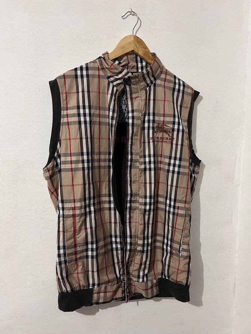 Burberry Black Label Nova Check Zip Vest (Category: Vests) located in Manila. Submitted by livedog-d301 (Listing ID 1464734412, Image 1). Description: - Authentic Burberry Black Label & Burberry London branding - Classic beige nova check pattern with stylish black contrast sides - Comfortable cotton and elastane blend material - High collar design with black ribbing trim - Unique large equestrian knight graphic printed on the inner lining - Perfe