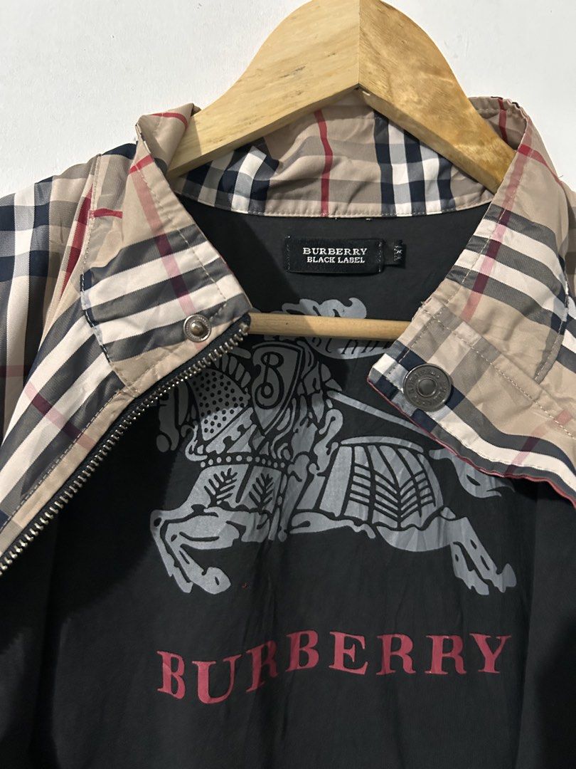 Burberry Black Label Nova Check Zip Vest (Category: Vests) located in Manila. Submitted by livedog-d301 (Listing ID 1464734412, Image 3). Description: - Authentic Burberry Black Label & Burberry London branding - Classic beige nova check pattern with stylish black contrast sides - Comfortable cotton and elastane blend material - High collar design with black ribbing trim - Unique large equestrian knight graphic printed on the inner lining - Perfe