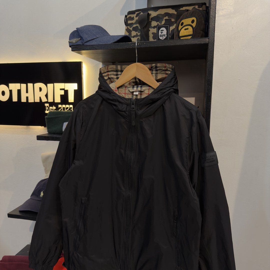 Burberry Black Windbreaker Jacket (Plaid Inside) (Category: Coats, Jackets and Outerwear) located in Manila. Submitted by jerichomal82553 (Listing ID 1464751071, Image 2). Description: Burberry Black Windbreaker Jacket (Plaid Inside) 21.5 by 25.5 Good Condition Missing Neck Tag CLAIM 1500.