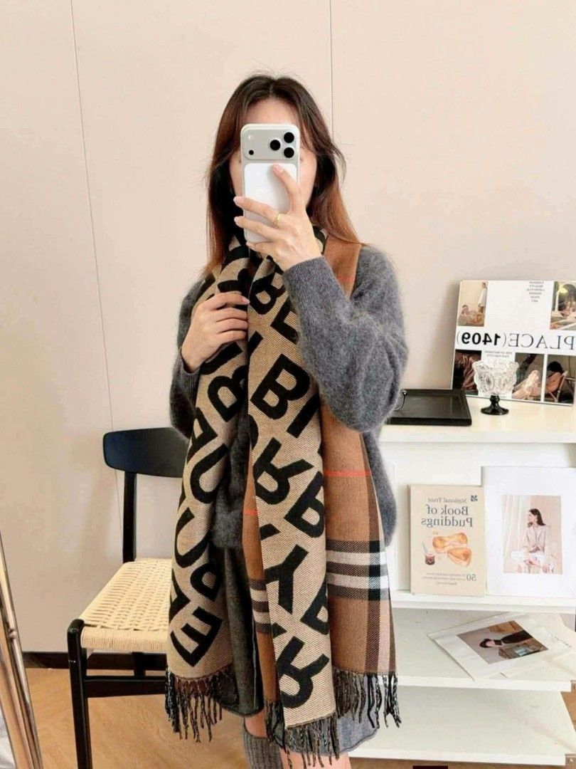 Burberry Nova Check Monogram Scarf (Category: Scarves) located in Pasig City. Submitted by farahoma15 (Listing ID 1464625787, Image 2). Description: - Authentic Burberry scarf - Iconic nova check and monogram print - Soft, comfortable material - Fringed edges for a classic look - Dimensions: Approx. [insert length] by [insert width] - Perfect for layering and adding warmth - Timeless and stylish accessory.