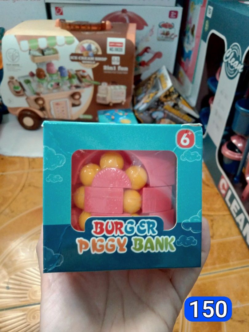 Burger Piggy Bank Toy (Category: Kids Toys) located in Caloocan City. Submitted by kairos417047873 (Listing ID 1464583601, Image 1). Description: Fun burger piggy bank for kids. Helps them save money in a playful way. Suitable for ages 6 and up. Great for teaching financial habits early. Comes in a colorful box..