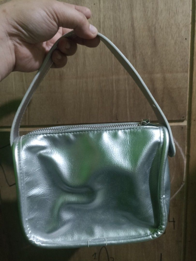 CAHRES&HEKA Silver Mini Shoulder Bag (Category: Shoulder Bags) located in Tarlac. Submitted by allinoneshop2178 (Listing ID 1464578374, Image 2). Description: - Cute silver mini bag from CAHRES&HEKA - Shiny metallic finish - Zipper closure - Compact size for essentials - Adorable star charm included - Ideal for nights out or adding sparkle to any outfit for other details pm me what you see is what you get .