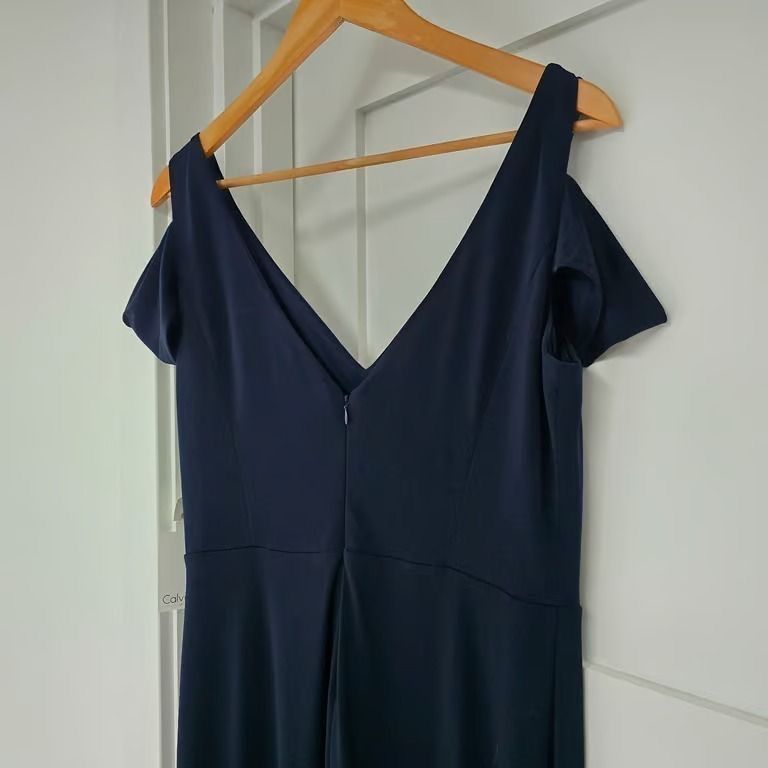 CALVIN KLEIN COLD SHOULDER MAXI DRESS (Category: Evening dresses & gowns) located in Marikina City. Submitted by minimalistmanila (Listing ID 1464652451, Image 3). Description: New Calvin Klein navy blue cold shoulder formal long dress, purchased in USA. Medium. Good quality. Great for wedding or formal parties. Comfy wear, not stiff fabric. Worth P10,500, sacrifice sale. Order now! ⭐️ .