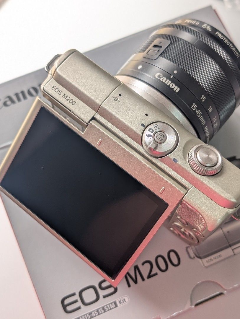 Canon EOS M200 LIMITED GOLD EDITION (Category: Cameras) located in Manila. Submitted by maria.phem (Listing ID 1464664429, Image 2). Description: Canon EOS M200 LIMITED EDITION [ALMOST NEW, BOXED UNIT 🌟] 🔖 32,000 PHP (fixed) ✧.* 24.2 MP ✧.* limited gold edition ✨ ✧.* 4k max movie resolution ✧.* pop-up flash 🌟 ✧.* built-in WiFi connectivity 🌟 ✧.* g7x mark iii dupe ✨ 💫 10/10 Body Cosmetics (mint condition) 🦀 no functional issues ✧˚ · . inclus