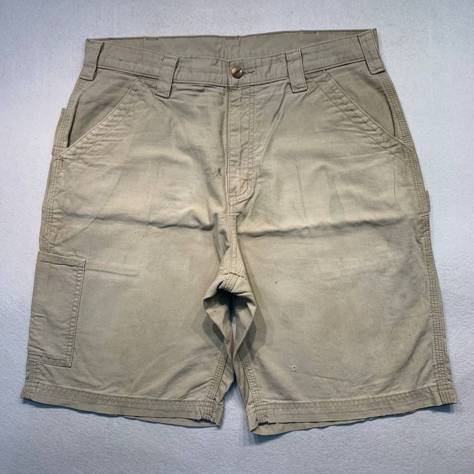 Carhartt B147 Tan Shorts (Category: Shorts) located in Mandaluyong City. Submitted by theroom501 (Listing ID 1464752052, Image 2). Description: Carhartt B147 Tan Shorts Style Code: B147 Tan Size on Tag: 34 Color: Tan Condition: Good pre-owned condition with visible signs of previous use. Flaws/Issues: visible yellow stain, and peeling leather patch. Flat Lay Measurements: Pit to Pit: 34 inches Length: 21 inches Leegopening Length: 12 inches Price