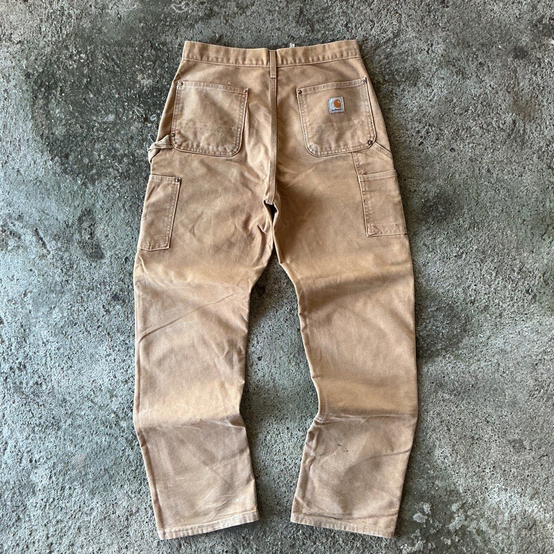 Carhartt Brown Double Knee (B01 BRN) (Category: Jeans) located in Santa Barbara. Submitted by evrysundayvintage (Listing ID 1464702099, Image 1). Description: Carhartt Brown Double Knee (B01 BRN) Dimensions Waist: 30” Length: 42.5” Leg opening: 8.5” Made in USA Paint splatters Signs of usage.
