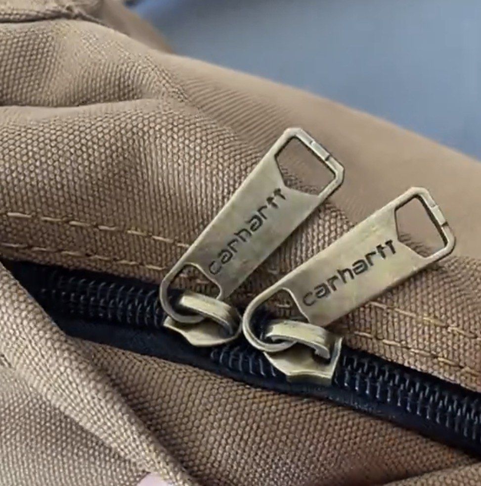 Carhatt Basic Backpack (Category: Backpacks) located in Singapore. Submitted by eth4nn._ (Listing ID 1464747884, Image 4). Description: - Color: Black/Brown -Preorder: 1-2 weeks, 50% deposit required - Material: Sturdy canvas - Storage: Front zip pocket - Details: Branded metal zipper pulls & woven Carhartt logo patch - Comfort: Padded shoulder straps - Condition: Brand new / Excellent daily use design.