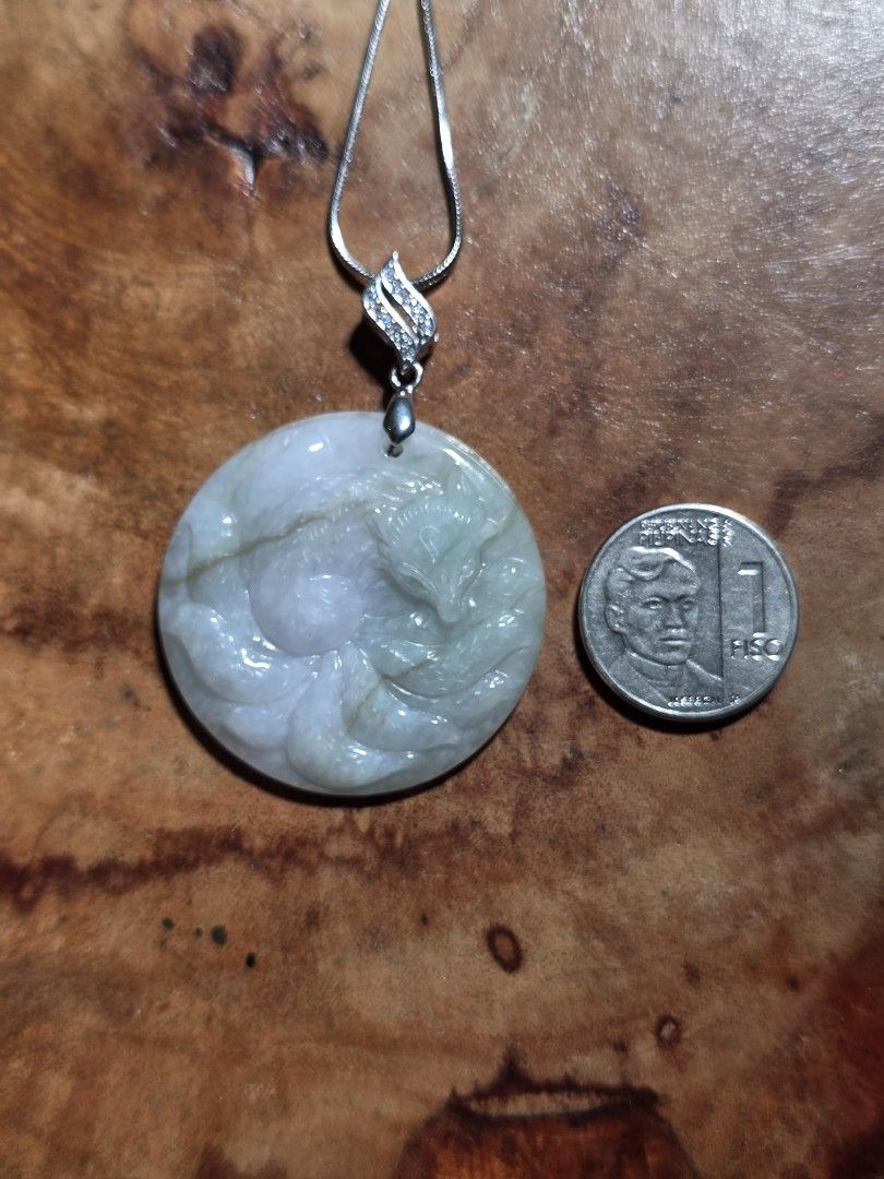 Carved Jade Pendant with Silver Chain (Category: Necklaces) located in Manila. Submitted by alyayeah (Listing ID 1464609461, Image 2). Description: - Genuine jade pendant with intricate 9 tailed fox carving - Beautiful light green and white color combination - Comes with a durable silver chain - Chain includes a sparkling diamond-like accent - Versatile piece for daily wear or special events - Unique and eye-catching design - Brand new, shipping 