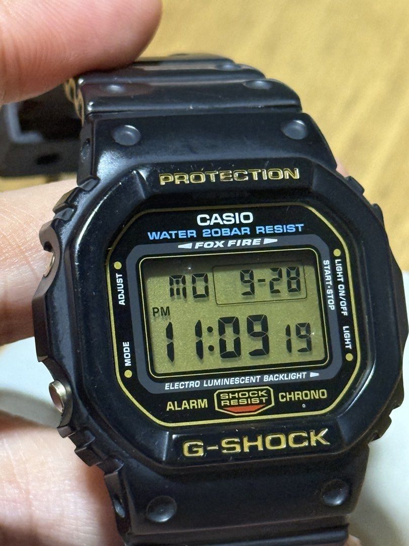 Casio G-Shock DW5600EG-9 Fox Fire RARE (Category: Luxury Watches) located in Manila. Submitted by kuyamene (Listing ID 1464733885, Image 2). Description: 90s G-Shock square model becoming hard to find Good condition Fox Fire variant - JDM model 1545 module Original bezel and strap with gold buckle Made in Korea (late 90s to early 00s) Minor issues One missing screw on back plate Aftermarket strap keeper.