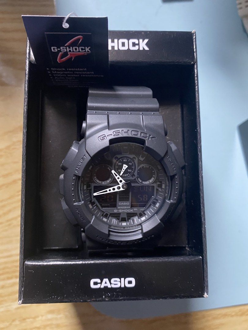 Casio G-Shock GA-100 Black Watch (Category: Men's Watches) located in Manila. Submitted by luistrokac48223 (Listing ID 1464763033, Image 3). Description: - Model: Casio G-Shock GA-100 (Matte Black) - Condition: Brand new, never worn, pristine condition - Durability: Shock resistant, magnetic resistant, and 200m water resistant - Inclusions: Original box and hang tag included - Perfect for daily wear or collection.