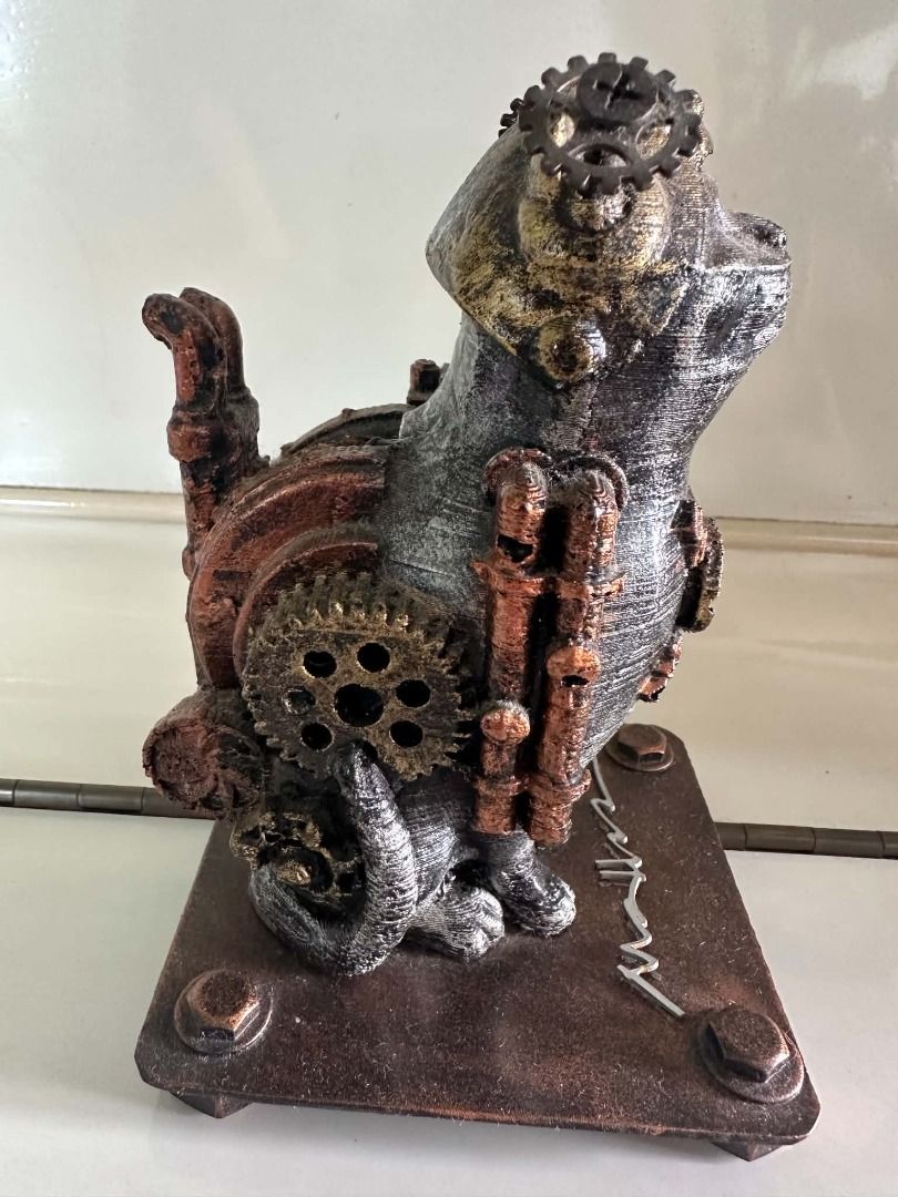 Cat Sculpture by Ram Mallari (Category: Figurines & Statues) located in Caloocan City. Submitted by wildfish_c7f4b4 (Listing ID 1464604006, Image 3). Description: Title: Steampunk Cat Medium: Reclaimed and welded metals, mixed media assemblage on metal base with artist signature Dimensions: Approx. H: 6-7 in (15-18 cm) incl. base Year: Contemporary Condition: Good. A charming steampunk cat sculpture by acclaimed Filipino artist Ram Mallari, widel