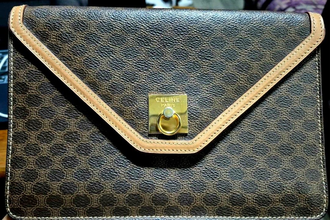 Celine Macadam Pattern Clutch Bag (Category: Clutches) located in Muntinlupa City. Submitted by coolstorm.2026 (Listing ID 1464585817, Image 1). Description: - Iconic Celine Macadam print in brown and tan. - Genuine leather trim and gold-tone hardware. - Secure snap button closure on the front flap. - Interior zip pocket for organized storage. - Celine Paris Made in Italy leather tag. - Compact and perfect for carrying your daily essentials. Othe