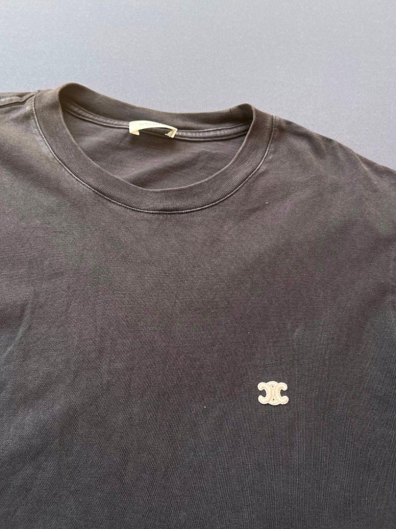 Celine Paris Logo T-Shirt (Category: Shirts) located in Pasacao. Submitted by kakiethriftapparel01217 (Listing ID 1464644806, Image 2). Description: - Classic black Celine t-shirt - Size: Medium (M) - Features iconic Triomphe logo on chest - Celine Paris print on sleeve - Material: 100% Cotton - Made in Italy.
