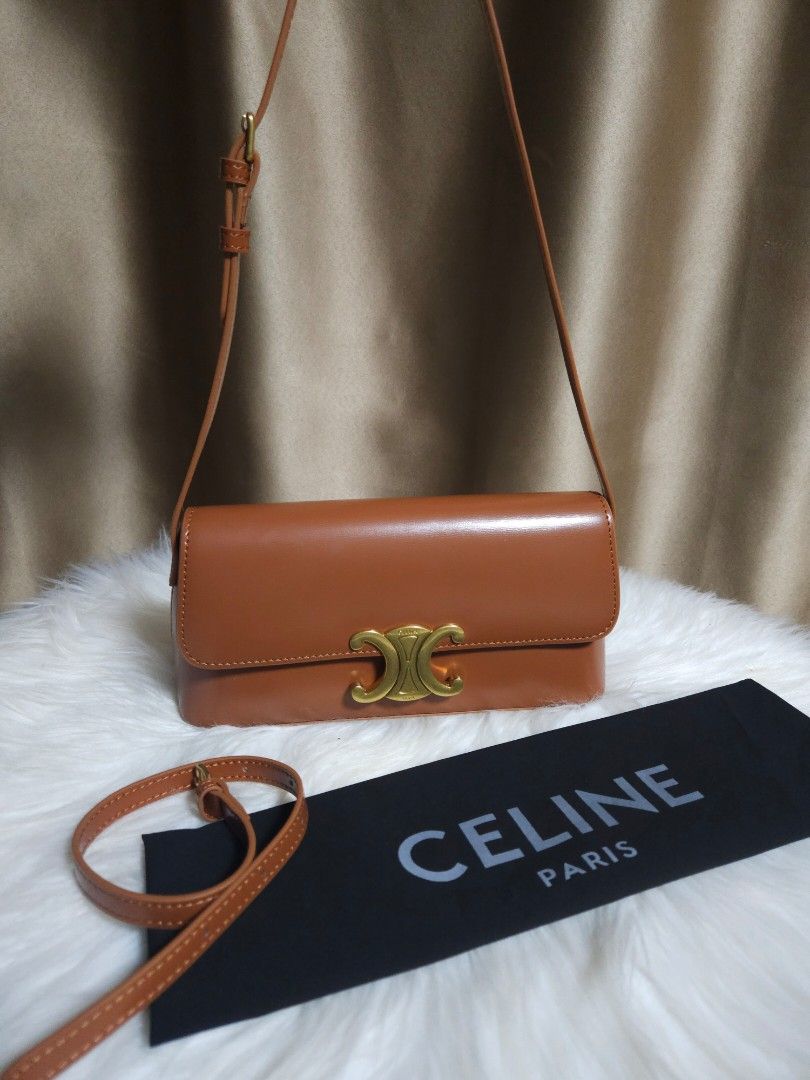 Celine Triomphe Bag Tan Leather (Category: Luxury Bags & Wallets) located in Manila. Submitted by sulit.deal (Listing ID 1464650629, Image 1). Description: - Japan Sourced - tan leather Celine crossbody bag - Features iconic gold Triomphe clasp - Adjustable strap for comfortable wear - Comes with original Celine dust bag - Versatile for daily use or special occasions - A timeless classic that complements any outfit.