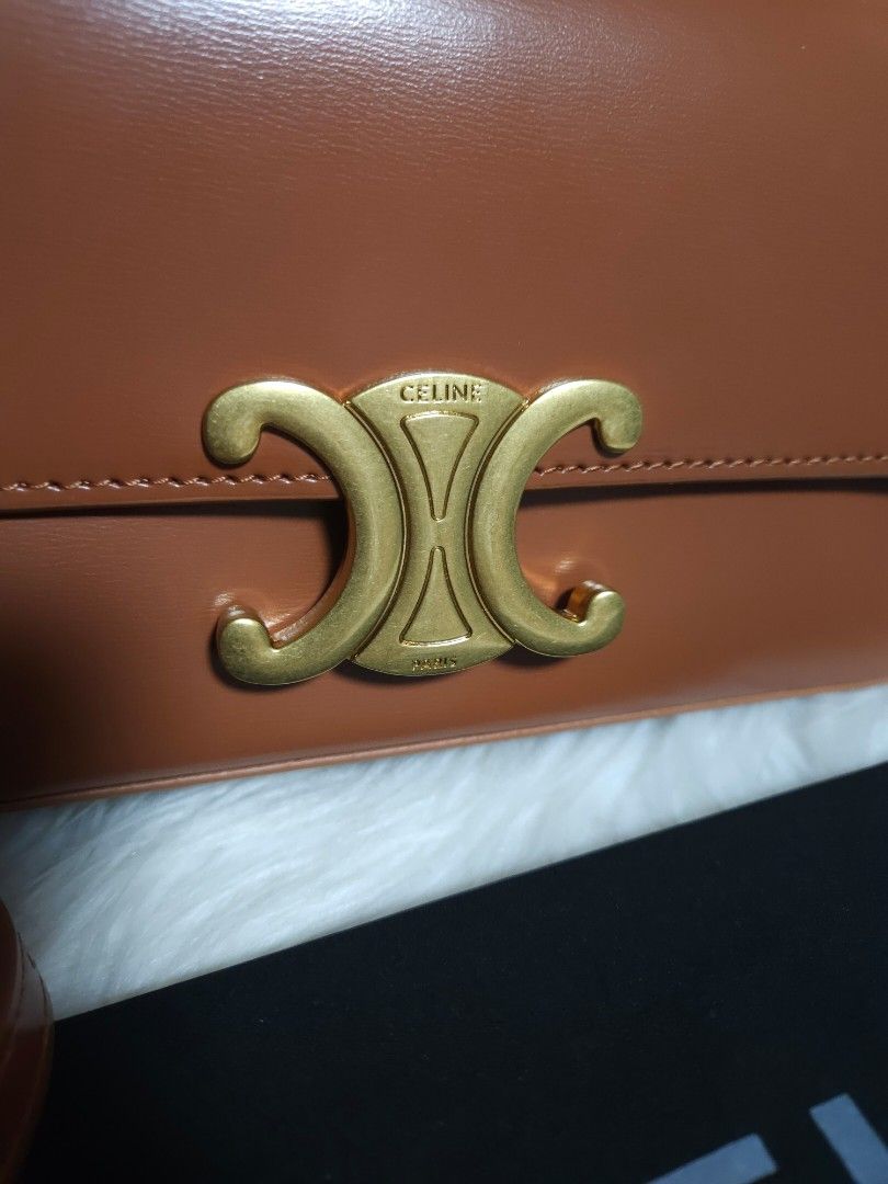 Celine Triomphe Bag Tan Leather (Category: Luxury Bags & Wallets) located in Manila. Submitted by sulit.deal (Listing ID 1464650629, Image 2). Description: - Japan Sourced - tan leather Celine crossbody bag - Features iconic gold Triomphe clasp - Adjustable strap for comfortable wear - Comes with original Celine dust bag - Versatile for daily use or special occasions - A timeless classic that complements any outfit.