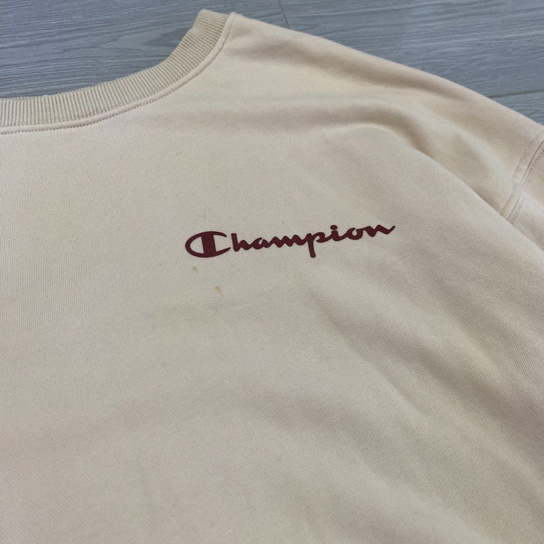 Champion Beige Sweatshirt (Category: Coats, Jackets and Outerwear) located in La Trinidad. Submitted by gemyi (Listing ID 1464676877, Image 2). Description: - Classic Champion sweatshirt in a light beige hue. - Needs wash (yellow dot stains) .