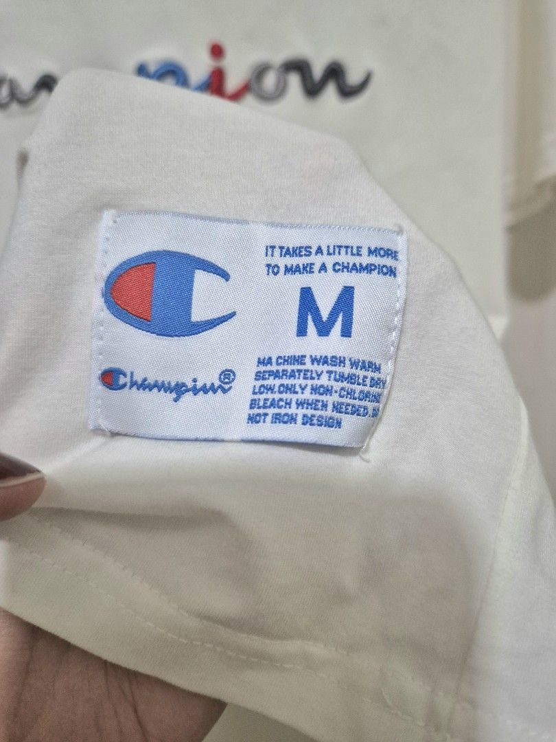 Champion Embroidered Logo Tee (Category: Shirts) located in San Mateo. Submitted by sellbypelle (Listing ID 1464660675, Image 3). Description: Brand: Champion Made in Canada Actual Measurements W: 19 inch (38 bust) stretchable L : 27 Issue: Broken line thread sa may neckline (see photo 4). Pero may double stitching sa loob, kaya hindi naman nakabukas tahi. Location: Rizal 💰 Payment: GCash — pay first 📦 Shipping: + sf via J&T only 🗓️ Batch ship