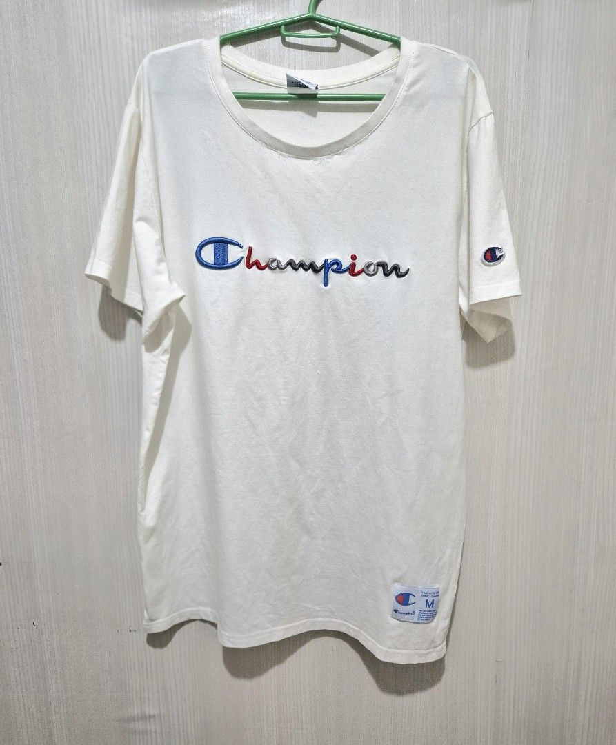 Champion Embroidered Logo Tee (Category: Shirts) located in San Mateo. Submitted by sellbypelle (Listing ID 1464660675, Image 1). Description: Brand: Champion Made in Canada Actual Measurements W: 19 inch (38 bust) stretchable L : 27 Issue: Broken line thread sa may neckline (see photo 4). Pero may double stitching sa loob, kaya hindi naman nakabukas tahi. Location: Rizal 💰 Payment: GCash — pay first 📦 Shipping: + sf via J&T only 🗓️ Batch ship
