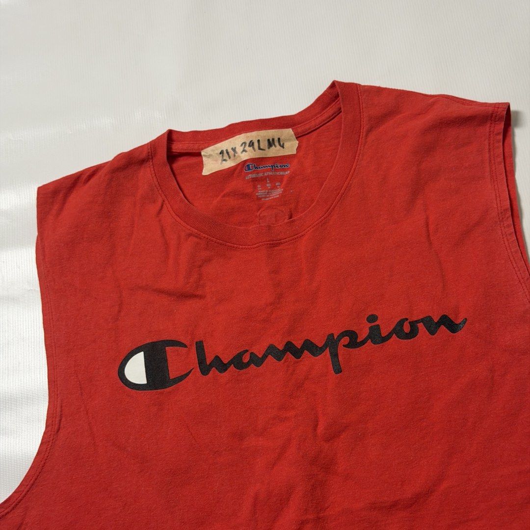 Champion Red Sleeveless Tank Top (Category: Tshirts & Polo Shirts ) located in Manila. Submitted by johnedel_james (Listing ID 1464686641, Image 2). Description: - Red Champion sleeveless tank top - Classic Champion logo across the chest - Small embroidered C logo on the back near the collar - Size: Large (L) - Perfect for workouts or casual wear - Note: Shows some signs of wear on the collar tag.