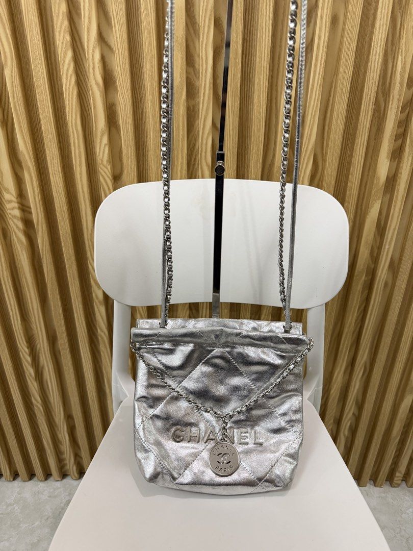 Chanel 22 Mini Handbag Metallic Silver (Category: Shoulder Bags) located in Cavite. Submitted by PRIVATE.Selection (Listing ID 1464617830, Image 2). Description: Chanel 22 Mini Handbag Metallic Silver -Crafted from diamond quilted metallic calfskin leather paired with tonal silver tone hardware. Has a Minor color fadings, check the last pics .