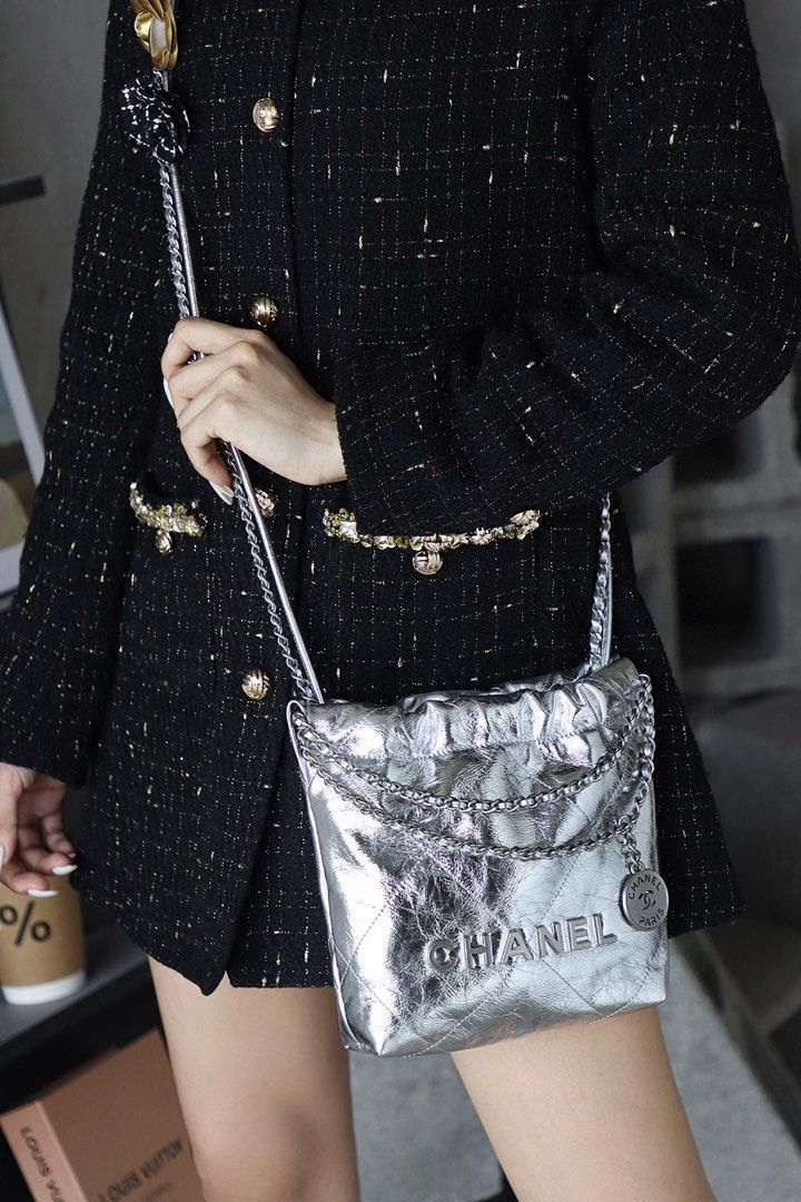 Chanel 22 Mini Handbag Metallic Silver (Category: Shoulder Bags) located in Cavite. Submitted by PRIVATE.Selection (Listing ID 1464617830, Image 3). Description: Chanel 22 Mini Handbag Metallic Silver -Crafted from diamond quilted metallic calfskin leather paired with tonal silver tone hardware. Has a Minor color fadings, check the last pics .