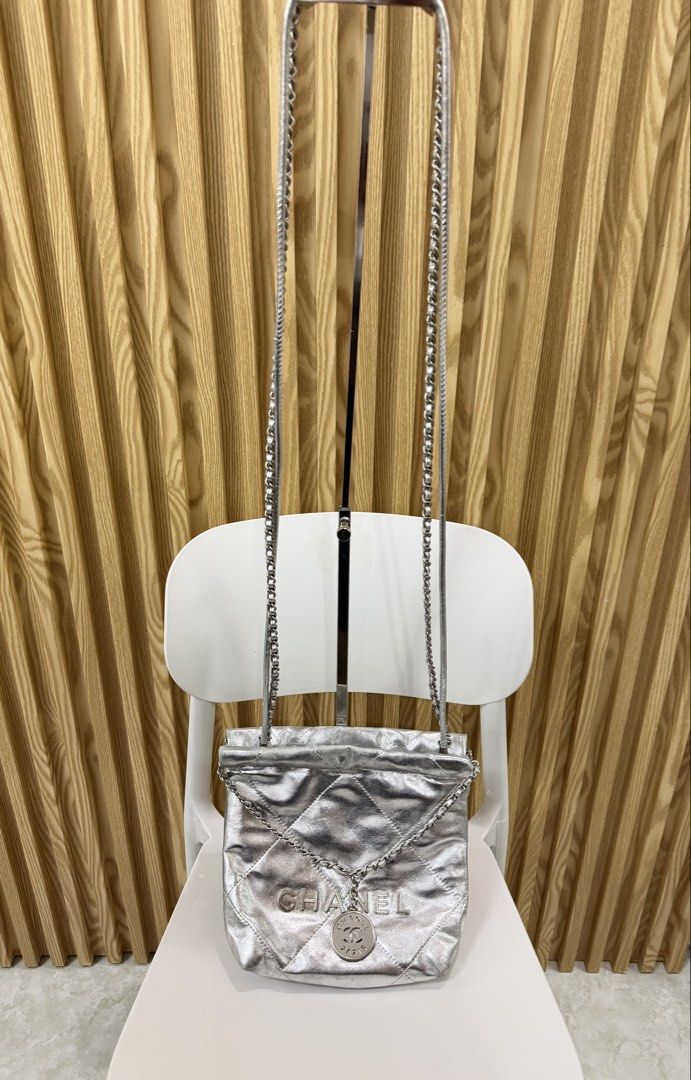 Chanel 22 Mini Handbag Metallic Silver (Category: Luxury Bags & Wallets) located in Imus. Submitted by rckrmns (Listing ID 1464738879, Image 2). Description: Chanel 22 Mini Handbag Metallic Silver -Crafted from diamond quilted metallic calfskin leather paired with tonal silver tone hardware. Has a Minor color fadings, check the last pics .