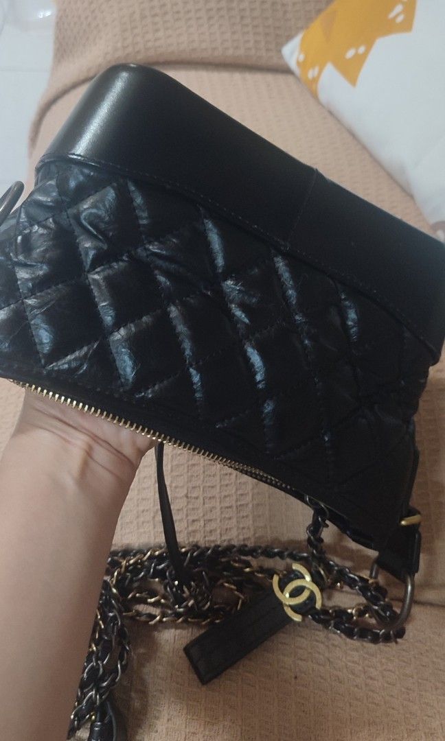 Chanel Black Quilted Leather Chain Shoulder Bag (Category: Luxury Bags & Wallets) located in Pasig City. Submitted by xcess_baggage (Listing ID 1461823425, Image 2). Description: - Black quilted leather - Gold chain straps - Zipper closure - Red interior lining - Made in Italy - Classic, versatile design for day or night.