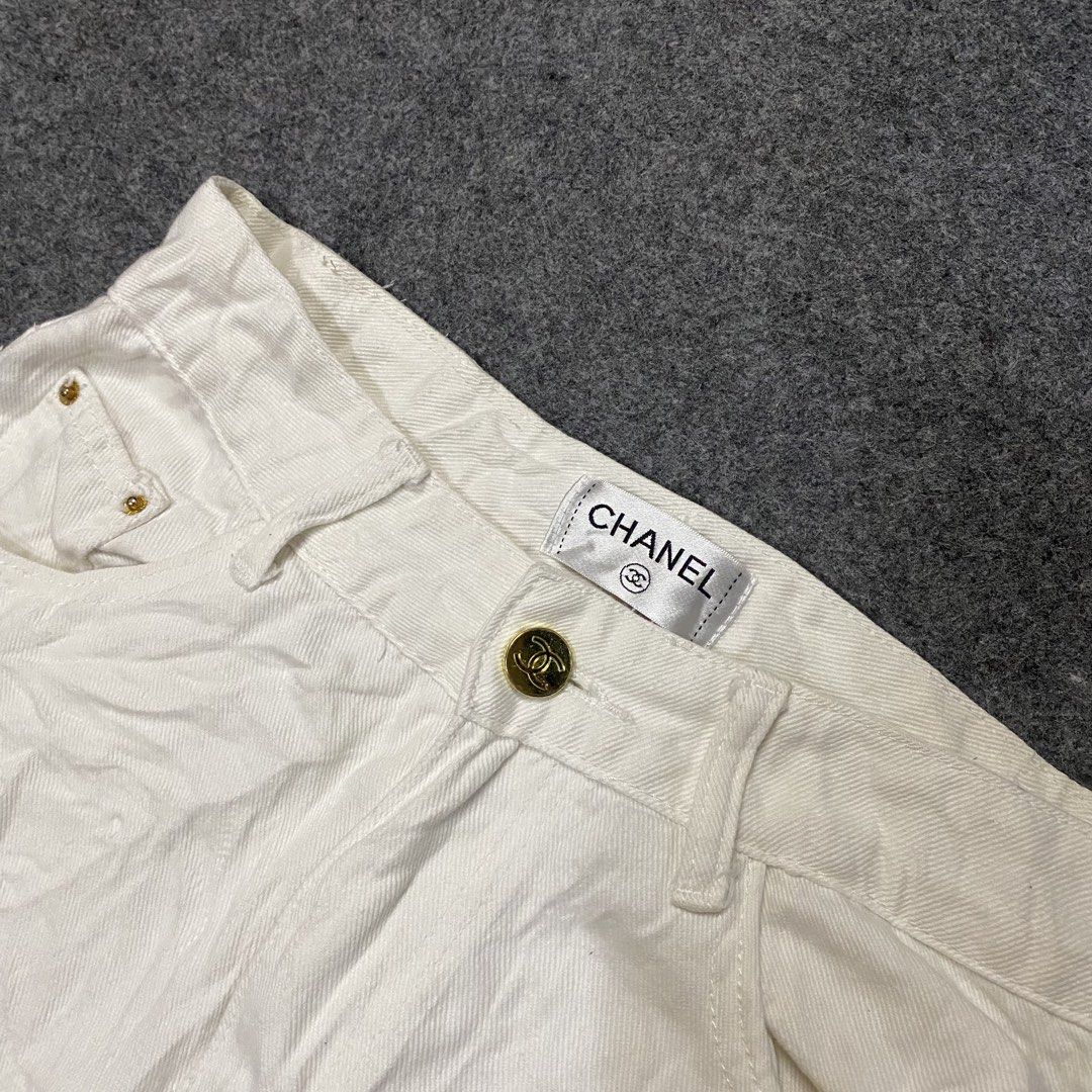 Chanel White Wide Leg Pants (Category: Jeans) located in Cebu City. Submitted by callmejasonx (Listing ID 1464658253, Image 3). Description: - Authentic Chanel white wide leg pants - Classic design with iconic CC logo embroidered on back pocket - Front button and zip closure - Comfortable and stylish, perfect for versatile styling -Waist 26 -Lenght 39 -Hem 9.5.
