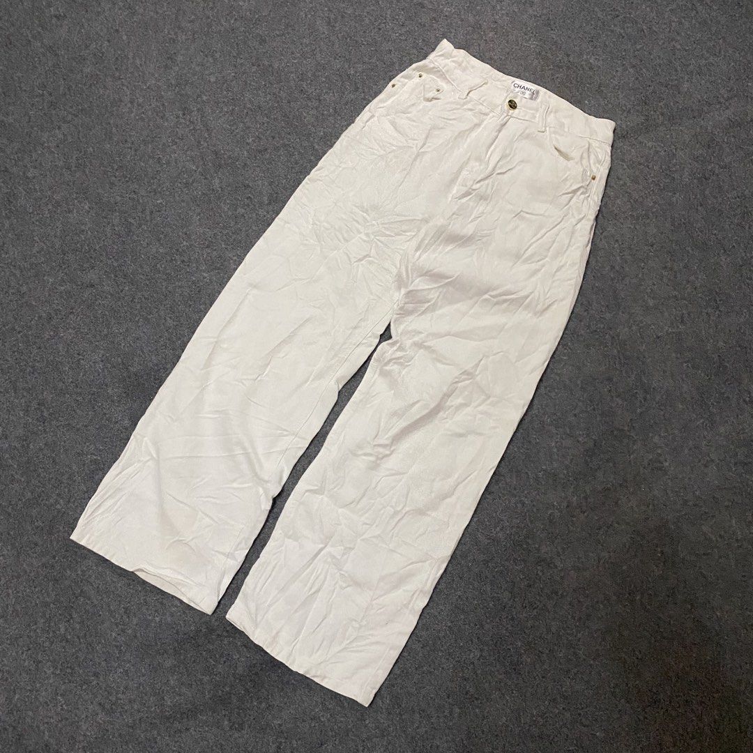 Chanel White Wide Leg Pants (Category: Jeans) located in Cebu City. Submitted by callmejasonx (Listing ID 1464658253, Image 1). Description: - Authentic Chanel white wide leg pants - Classic design with iconic CC logo embroidered on back pocket - Front button and zip closure - Comfortable and stylish, perfect for versatile styling -Waist 26 -Lenght 39 -Hem 9.5.