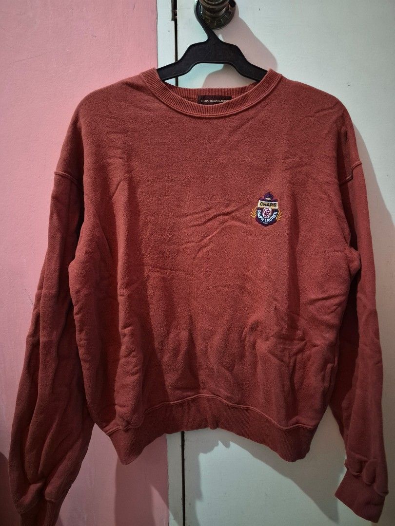 Chaps by Ralph Lauren Sweatshirt (Category: Coats, Jackets and Outerwear) located in Bulacan. Submitted by mrk_mdl (Listing ID 1464712288, Image 2). Description: - Brand/Model: Chaps Ralph Lauren - Color: Rust red - Size: Medium (tag on collar) - Design: Embroidered crest logo on chest, large printed lettering on back (Ralph Lauren, Chaps, 1978, spirited tradition) - Details: Ribbed cuffs and hem - Fit: Comfortable for daily wear.