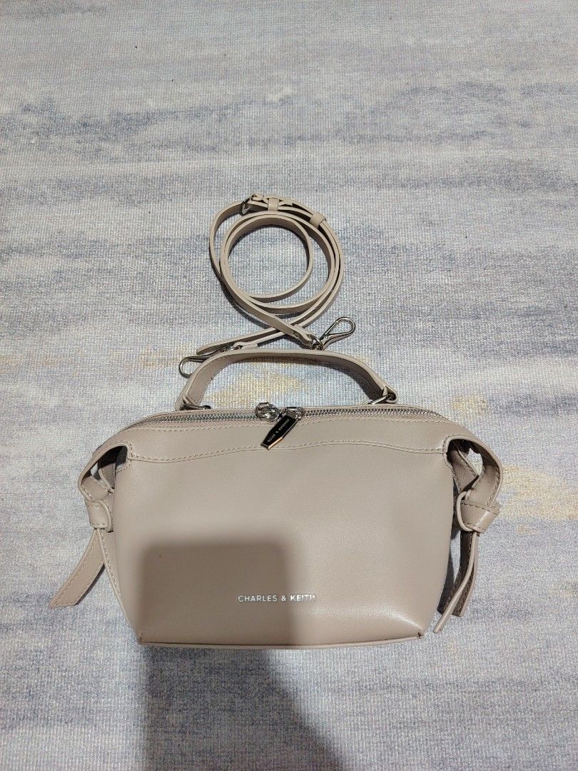 CHARLES & KEITH (Category: Cross-body Bags) located in Dagupan City. Submitted by gandita.28 (Listing ID 1464599402, Image 1). Description: CHARLES & KEITH AURELIE KNOTTED TOP TAUPE COLOR EXCELLENT TO BRANDNEW CONDITION 💯 SUPER CUTE.