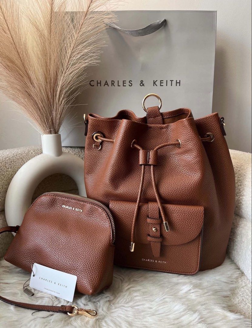 Charles & Keith Backpack with pouch -Brown (Category: Backpacks) located in Pasig City. Submitted by preloved.closet2 (Listing ID 1464763633, Image 1). Description: Backpack with Pouch Extra Shoulder strap Size large Can fit ipad Chocolate Brown Color Add paperbag plus 80.