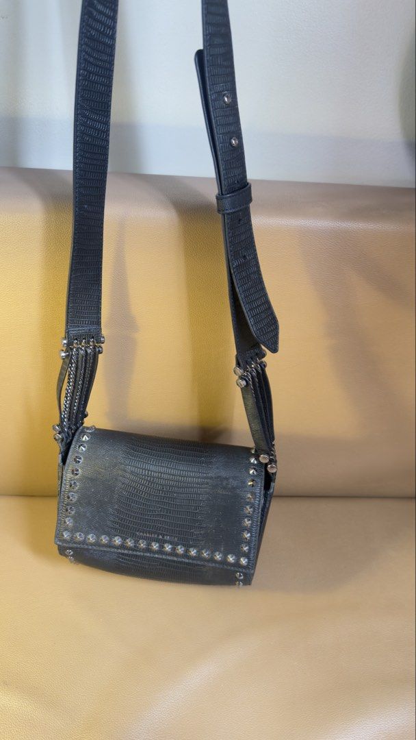 Charles & Keith Black Textured Crossbody Bag (Category: Cross-body Bags) located in Manila. Submitted by iflipworks (Listing ID 1464602685, Image 1). Description: Charles & Keith Black Textured Crossbody Bag Pre-loved Charles & Keith crossbody bag in black textured finish. Selling Price: 1k Brand New Price: 3.6K * Adjustable crossbody strap * Silver-tone hardware * Stud detailing * Interior zip pocket * Charles & Keith branded hardware * Includes