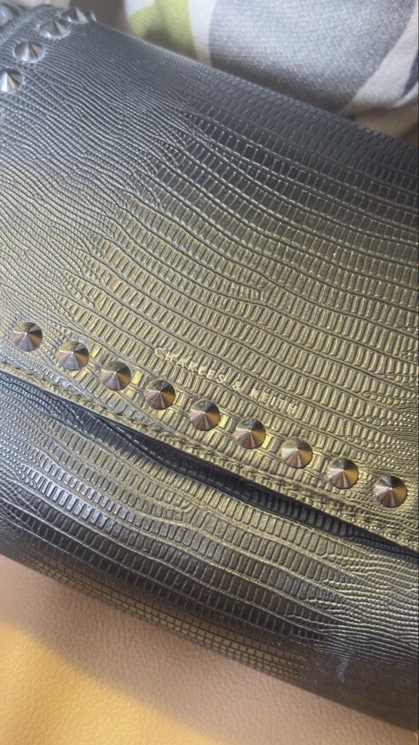 Charles & Keith Black Textured Crossbody Bag (Category: Cross-body Bags) located in Manila. Submitted by iflipworks (Listing ID 1464602685, Image 3). Description: Charles & Keith Black Textured Crossbody Bag Pre-loved Charles & Keith crossbody bag in black textured finish. Selling Price: 1k Brand New Price: 3.6K * Adjustable crossbody strap * Silver-tone hardware * Stud detailing * Interior zip pocket * Charles & Keith branded hardware * Includes