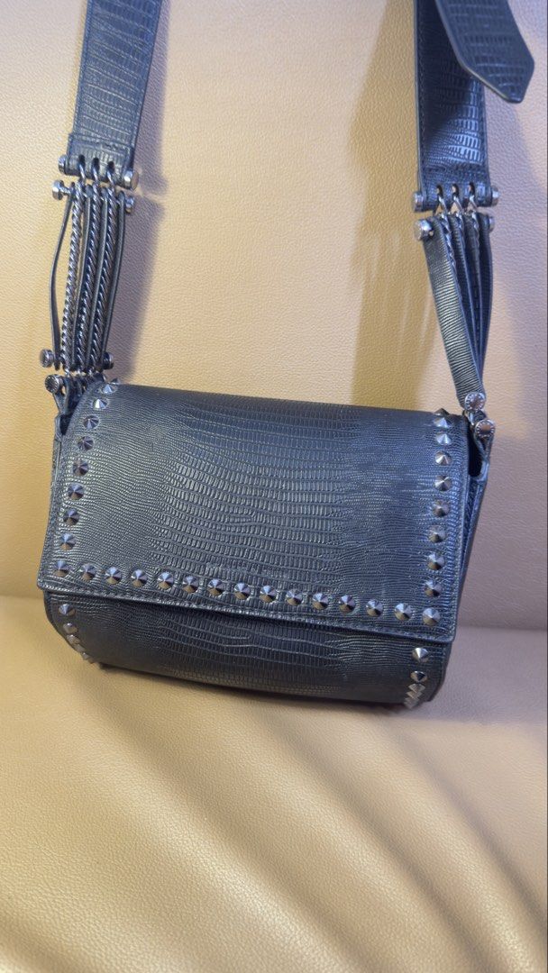Charles & Keith Black Textured Crossbody Bag (Category: Cross-body Bags) located in Manila. Submitted by iflipworks (Listing ID 1464602685, Image 2). Description: Charles & Keith Black Textured Crossbody Bag Pre-loved Charles & Keith crossbody bag in black textured finish. Selling Price: 1k Brand New Price: 3.6K * Adjustable crossbody strap * Silver-tone hardware * Stud detailing * Interior zip pocket * Charles & Keith branded hardware * Includes