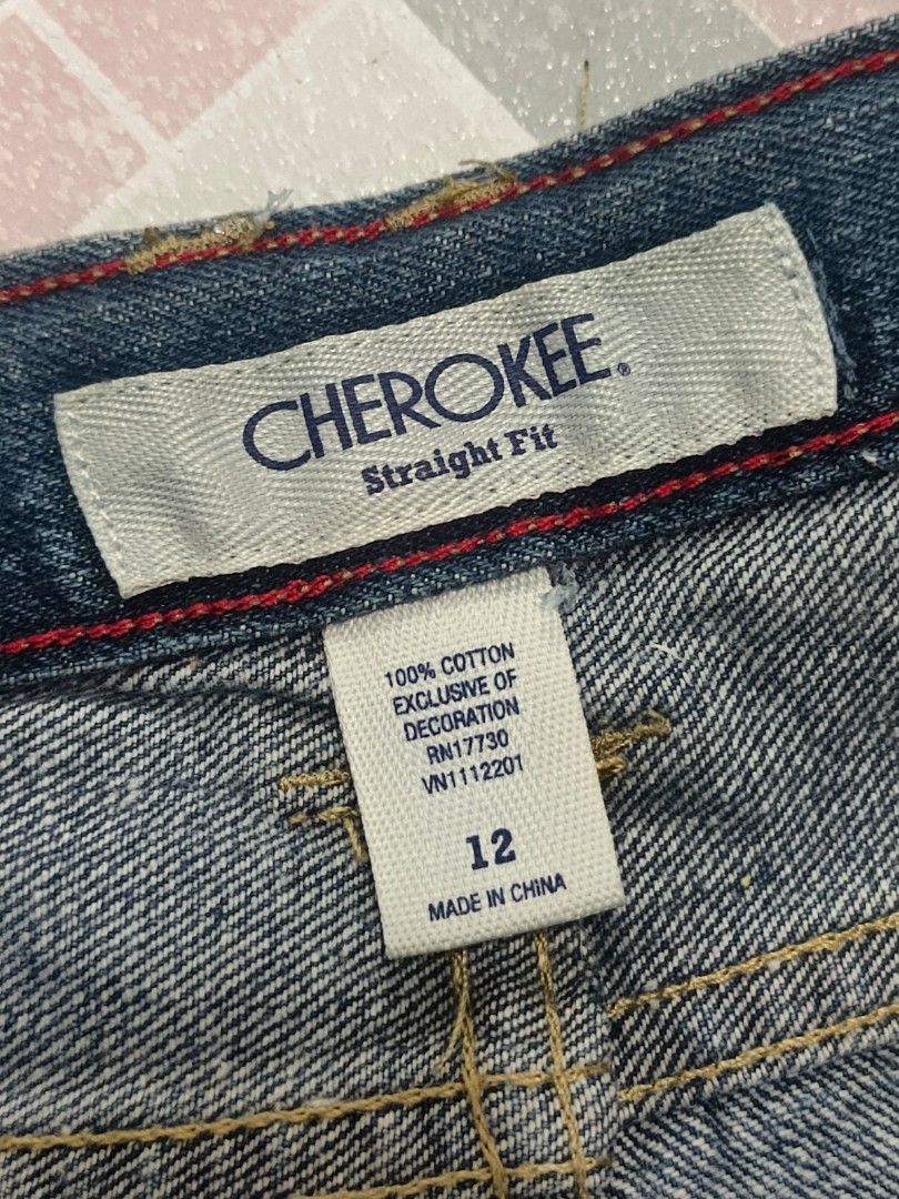 Cherokee Straight Fit Jeans Size 12 (Category: Babies & Kids Fashion) located in Paranaque City. Submitted by zirem (Listing ID 1464626532, Image 3). Description: - Brand: Cherokee - Style: Straight Fit Jeans - Size: 12 - Color: Blue Denim - Length: 32 inches - Waist: 13 inches (laid flat) - Features: Adjustable waist buttons inside, distressed details on pockets - Origin: Made in China - Condition: Please check photos for exact condition..
