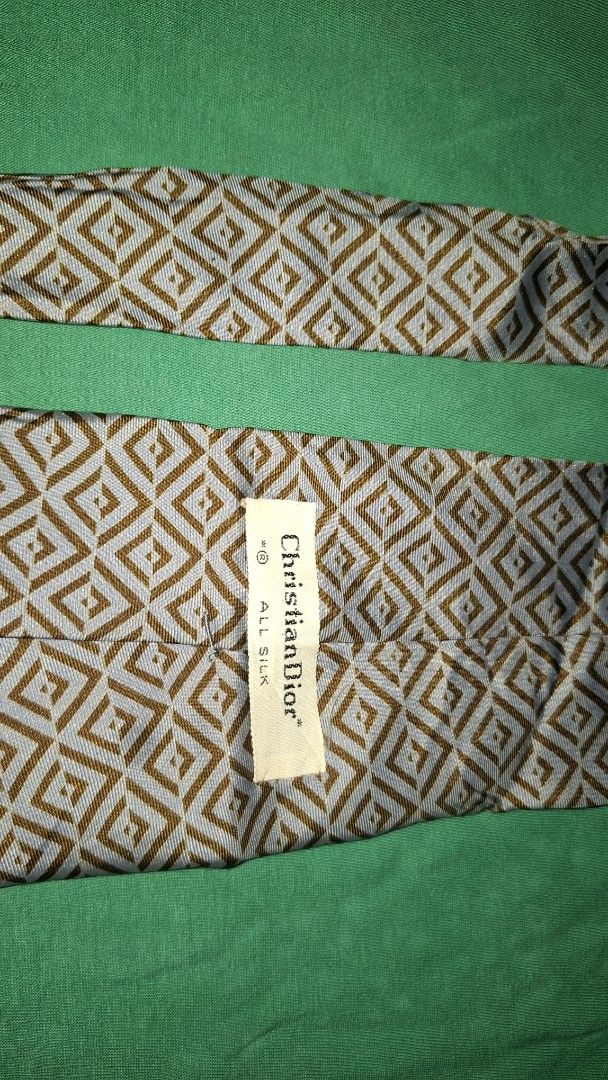 Christian Dior Silk Tie (Category: Luxury Apparel) located in Coron. Submitted by sirizchoice (Listing ID 1464579026, Image 3). Description: - Authentic Christian Dior tie - 100% Silk - Ideal for formal occasions or elevating any outfit.