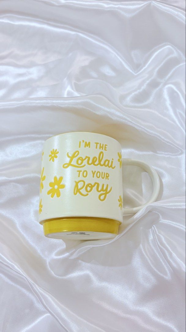 Christmas mug - 249 each (Category: Coffee & Tea Tableware) located in Manila. Submitted by declutteringmyclosetttt (Listing ID 1464584588, Image 3). Description: - Set of two cute mugs. - Gingerbread house mug, perfect for holiday drinks. - Yellow and white mug with 'I'm the Lorelai to your Rory' quote, ideal for Gilmore Girls fans. - Both mugs are clean and ready for immediate use..
