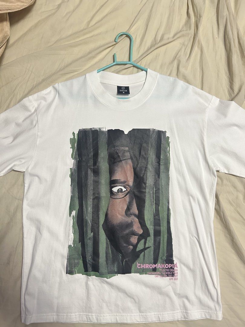Chromakopia Graphic T-Shirt (Category: Tshirts & Polo Shirts ) located in Marikina City. Submitted by traxwap (Listing ID 1464570713, Image 1). Description: - White graphic tee from Chromakopia - Features a striking portrait design on the front - Typo on the shirt (says “Tyler the Creation”) on the bottom right - Size: Medium (M) - Great addition to any collection.
