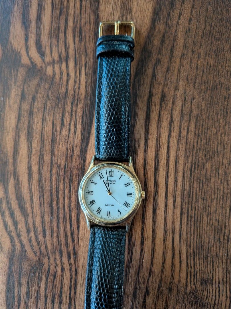 Citizen Eco-Drive Junction Gold Tone Watch (Category: Men's Watches) located in Quezon City. Submitted by brentmaloto (Listing ID 1464737302, Image 1). Description: Power: Eco-Drive technology (powered by light, no battery changes ever needed) Dial Reference: E030-011533 Serial Number: 110252 Dial & Case: Pristine white dial with classic black Roman numerals, gold-tone bezel Strap: 18mm textured black leather strap with gold-tone pin buckle Condi