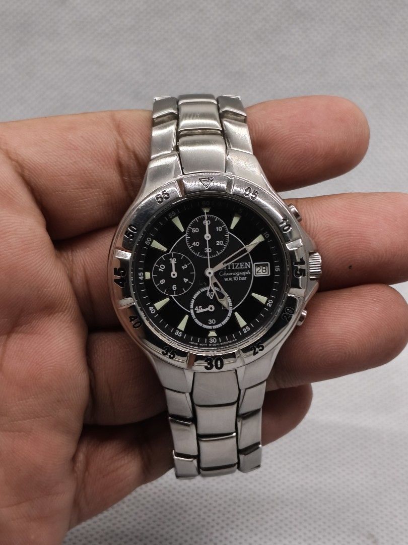 Citizen Quartz Chronograph (Category: Men's Watches) located in Pasig City. Submitted by timepiece-and-co (Listing ID 1464662150, Image 3). Description: Key Technical Specifications Movement: Citizen Caliber 0510 Quartz movement. Water Resistance: 10 Bar (equivalent to 100 meters / WR 100). Dial Features: Features a black dial with three chronograph sub-dials (60-minute register at 12, 12-hour register at 9, and running sub-seconds at 6) alongsid