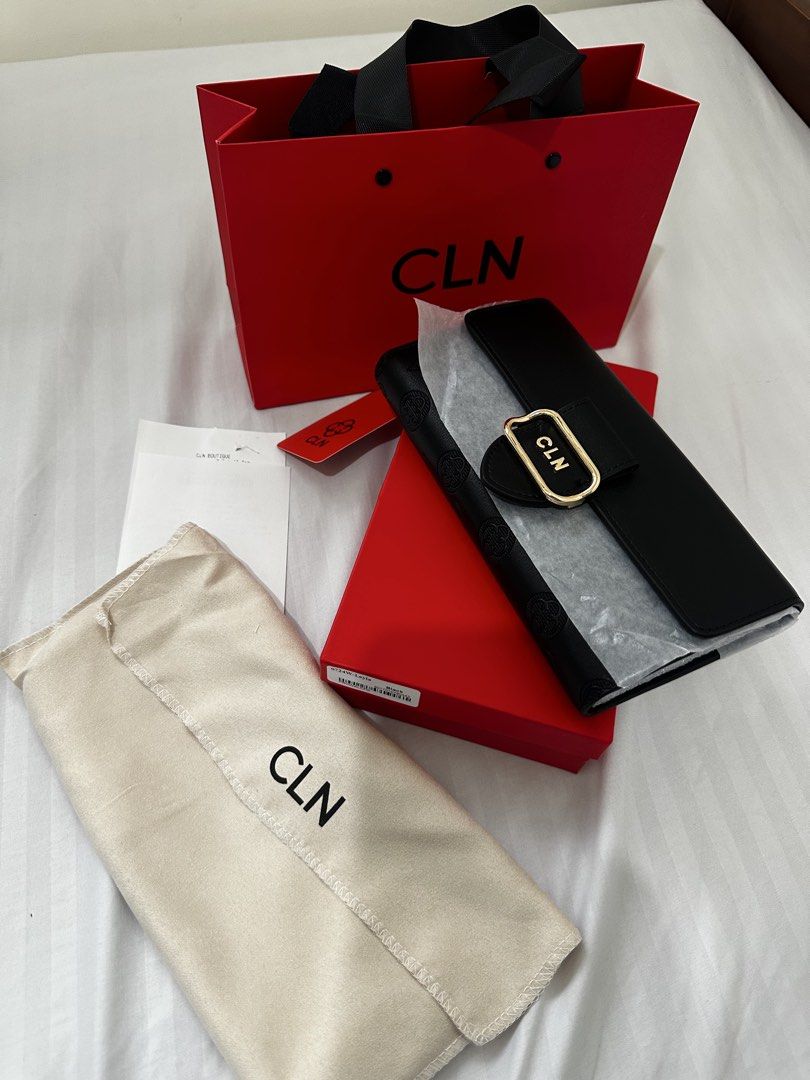 CLN Black Embossed Long Wallet with Gold Buckle (Category: Wallets & Card holders) located in Manila. Submitted by calingasan29834 (Listing ID 1464650721, Image 1). Description: - Black CLN long wallet - All-over embossed pattern - Gold buckle closure - Comes with dust bag, box, and shopping bag - Ideal for organizing your essentials.