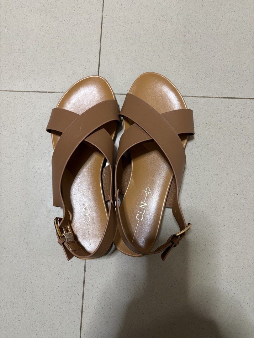 CLN Brown Criss-Cross Strap Sandals (Category: Flats & Sandals) located in Antipolo. Submitted by curatedbyapril_777 (Listing ID 1464664082, Image 1). Description: - Brand: CLN - Color: Brown - Design: Criss-cross straps - Features: Adjustable buckle strap at the back - Sole: Comfortable flat sole - Occasion: Great for casual wear or dressing up.