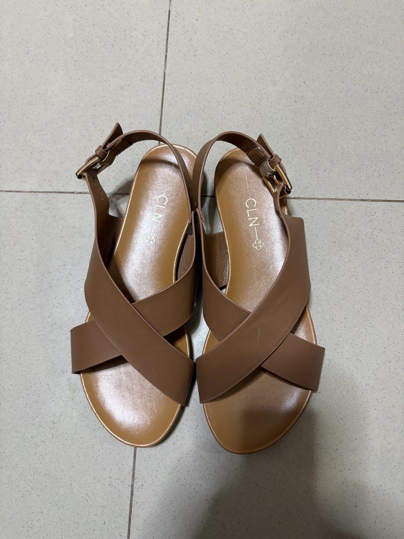 CLN Brown Criss-Cross Strap Sandals (Category: Flats & Sandals) located in Antipolo. Submitted by curatedbyapril_777 (Listing ID 1464664082, Image 2). Description: - Brand: CLN - Color: Brown - Design: Criss-cross straps - Features: Adjustable buckle strap at the back - Sole: Comfortable flat sole - Occasion: Great for casual wear or dressing up.