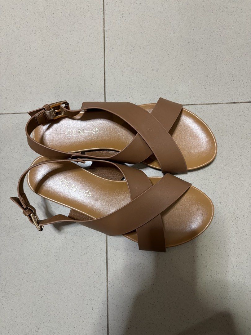 CLN Brown Criss-Cross Strap Sandals (Category: Flats & Sandals) located in Antipolo. Submitted by curatedbyapril_777 (Listing ID 1464664082, Image 3). Description: - Brand: CLN - Color: Brown - Design: Criss-cross straps - Features: Adjustable buckle strap at the back - Sole: Comfortable flat sole - Occasion: Great for casual wear or dressing up.