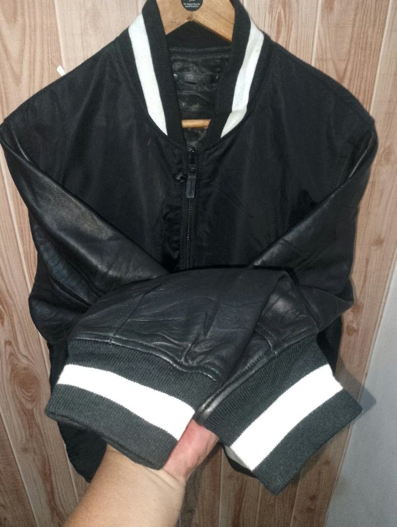 COACH (Category: Coats, Jackets and Outerwear) located in Taguig. Submitted by clothingselection (Listing ID 1464698131, Image 3). Description: PTPA COACH Varsity Bomber Jacket — Nylon / Leather Sleeves — Size L Premium varsity bomber — water-resistant nylon body with smooth leather sleeves. Classic striped rib trim, full zip with branded pull, 2 front pockets. Details: ✔️ Brand: Coach New York ✔️ Size: Large ✔️ Body: 100% Nylon | Sleeves: Genuin