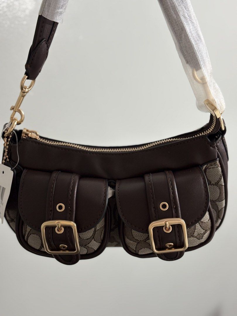 Coach Ashton Bag (Category: Luxury Bags & Wallets) located in Abucay. Submitted by erindeclutterss (Listing ID 1464579696, Image 1). Description: drop your offerss 🫶 - Brand new - Auth viet variant - Gold hardware and buckle details on front pockets - Includes original tags.